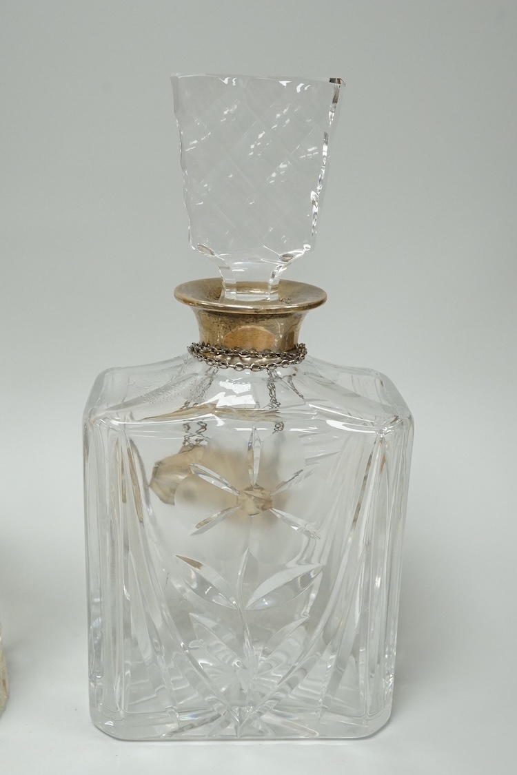 A late Victorian silver mounted cut glass mug, Saunders & Shepherd, Chester, 1899, height 13.4cm, together with a modern silver mounted cut glass decanter and a modern pair of silver 'Whisky' and 'Brandy' wine labels, J.